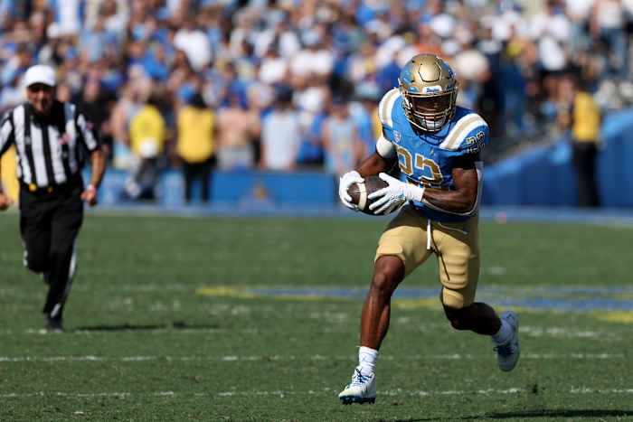 UCLA Bruins running back Keegan Jones carries the football.